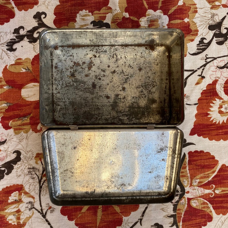 Antique metal tin